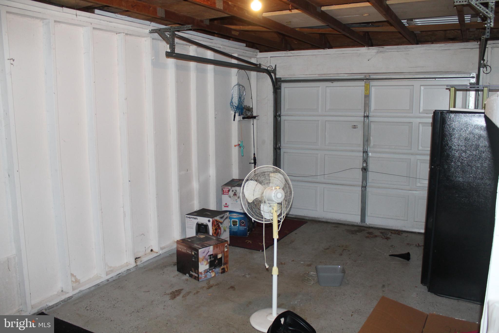 182 Warren Way Lancaster, PA 17601 - Photo 16 of 18 a view of storage and utility room with racks on the wall