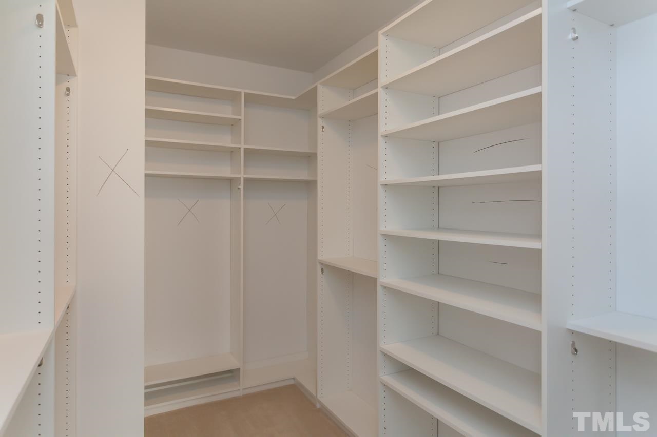 1232 Harp Street Raleigh, NC 27604 - Photo 19 of 25 a view of walk in closet with empty racks
