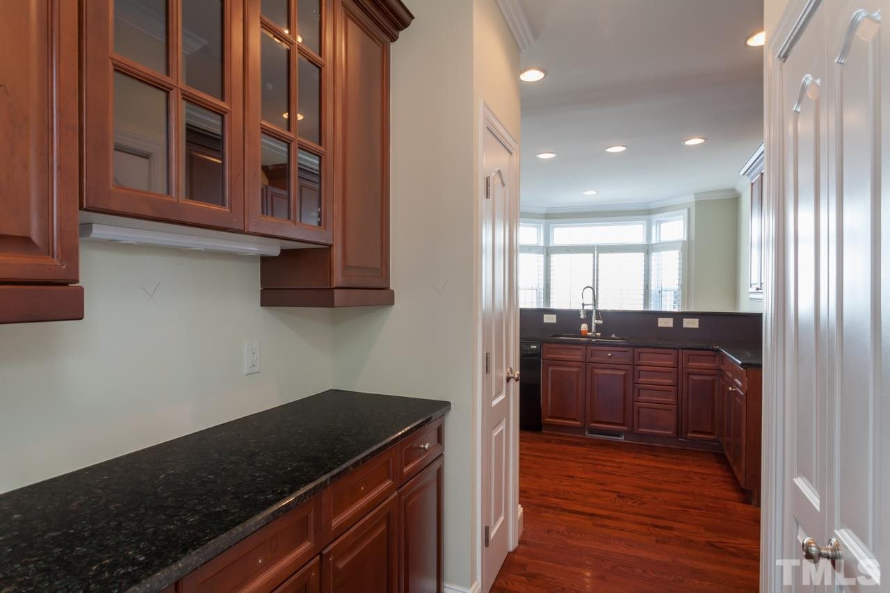 1232 Harp Street Raleigh, NC 27604 - Photo 9 of 25 a kitchen with a sink and cabinets