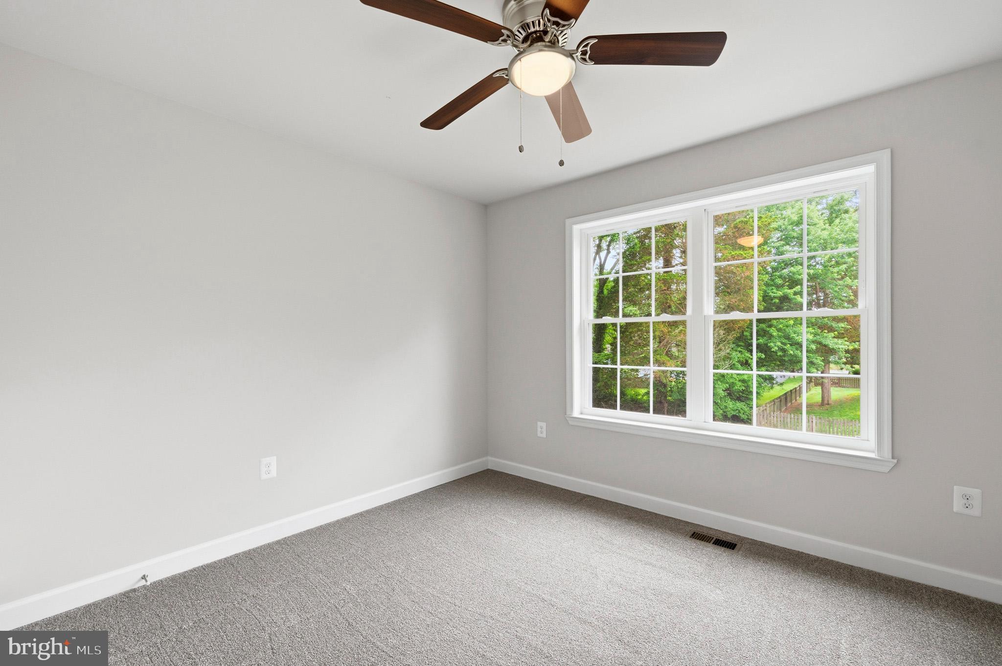 29725 Bruce Road Mechanicsville, MD 20659 - Photo 67 of 79 an empty room with a window and a fan