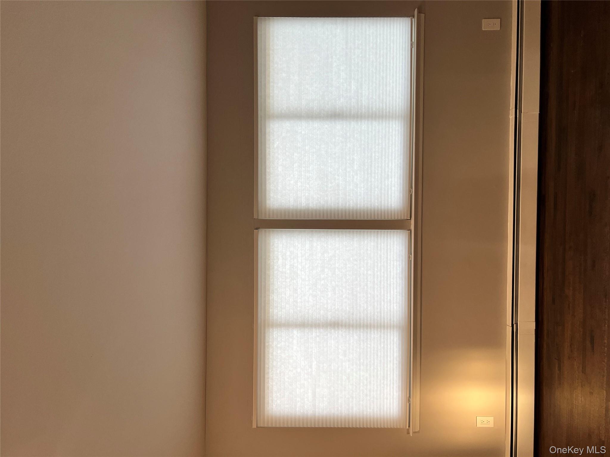 39 B South Norwood Road, Unit RIGHT Port Washington, NY 11050 - Photo 16 of 18 a view of room with window