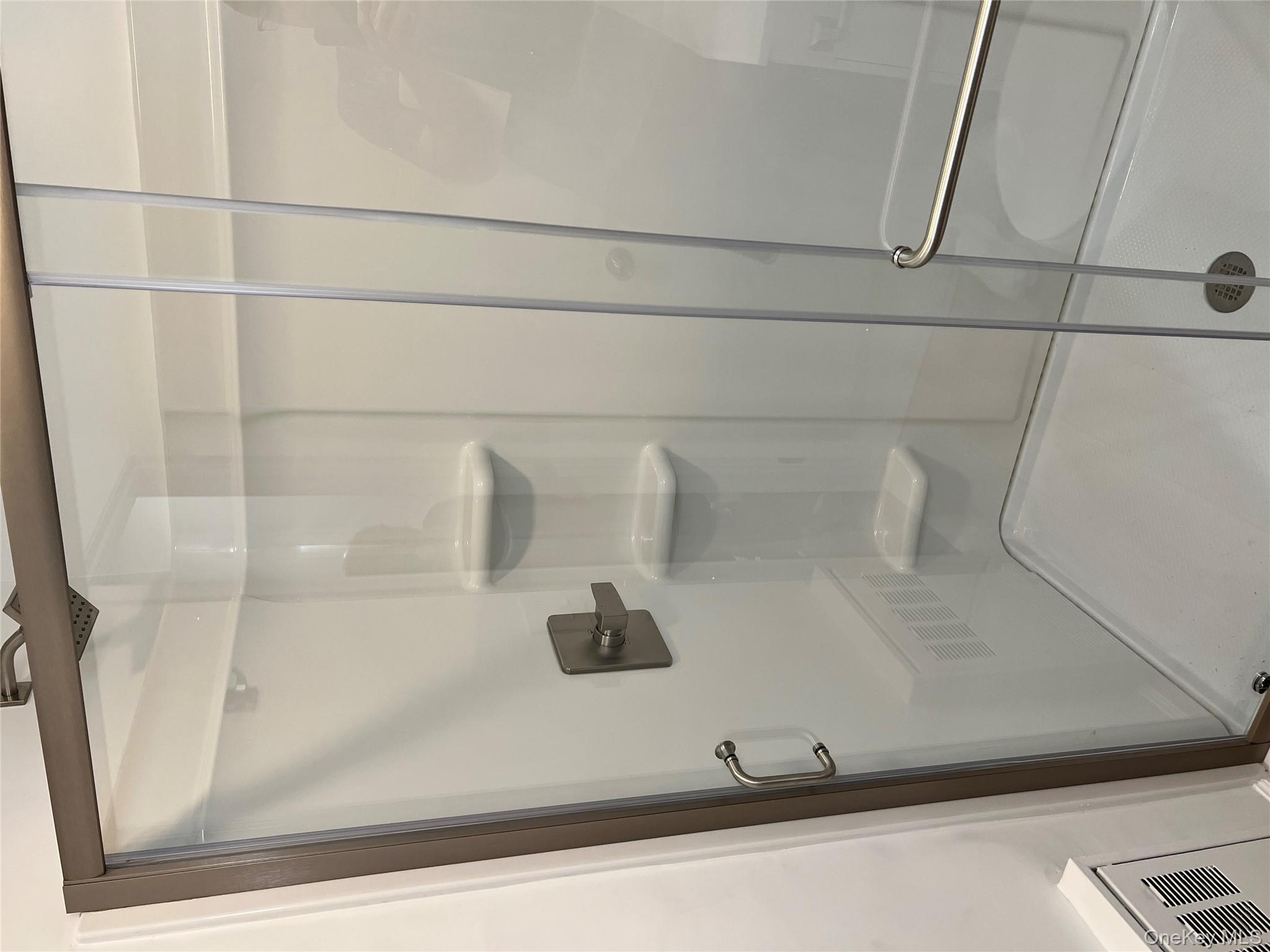 39 B South Norwood Road, Unit RIGHT Port Washington, NY 11050 - Photo 17 of 18 a bathroom with a shower