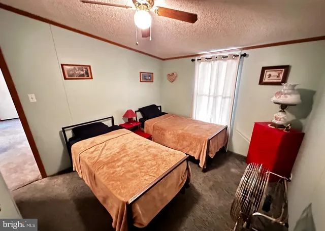 a bedroom with bed and a window