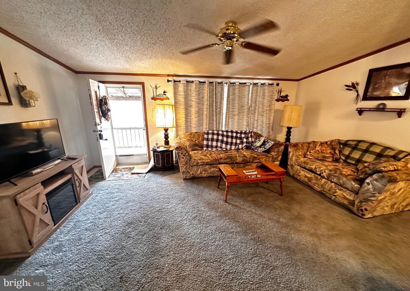 98 Bear Run Road Oakland, MD 21550 - Photo 14 of 28 a living room with furniture and a flat screen tv