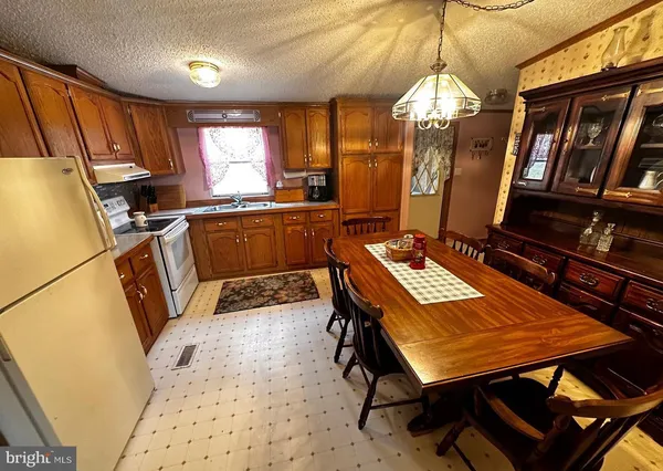 a room with wooden furniture and window