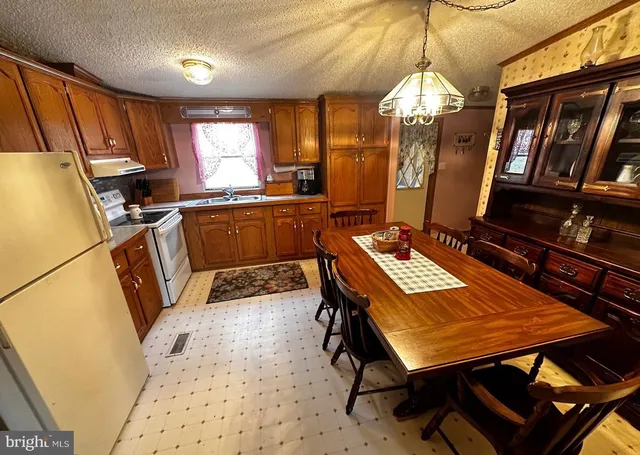 a room with wooden furniture and window