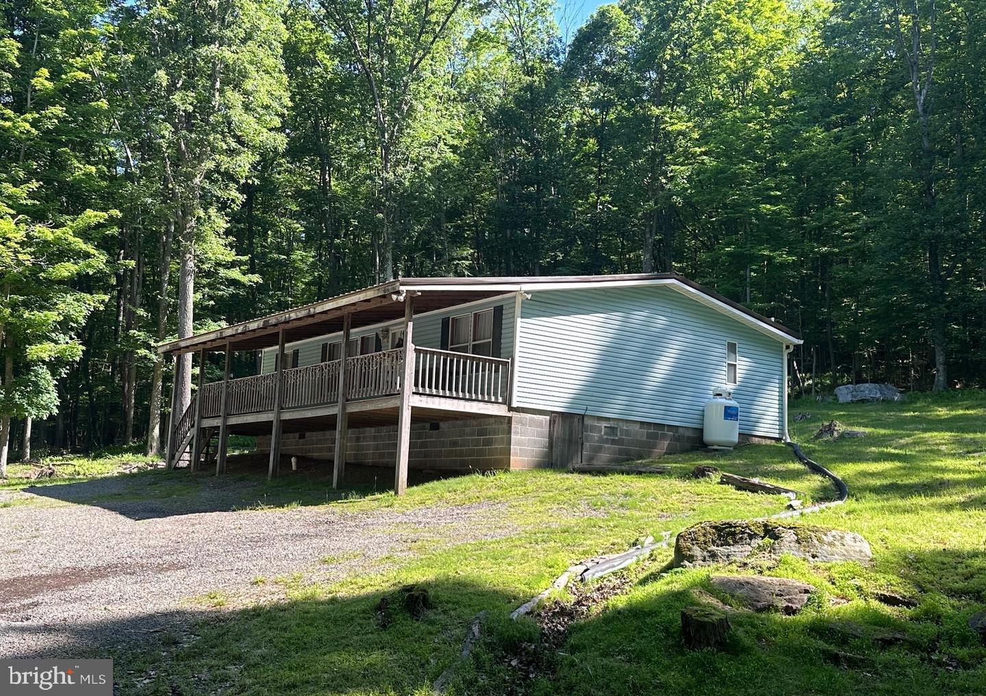 98 Bear Run Road Oakland, MD 21550 - Photo 7 of 28 a front view of a house with a yard