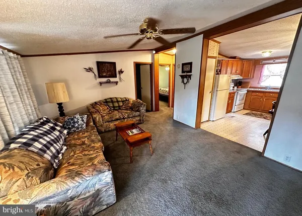a bedroom with furniture and a large window