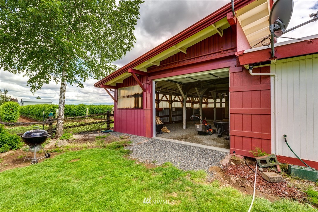 1506 Pangborn Road Lynden, WA 98264 - Photo 29 of 40 a view of backyard with table and chairs and potted plants