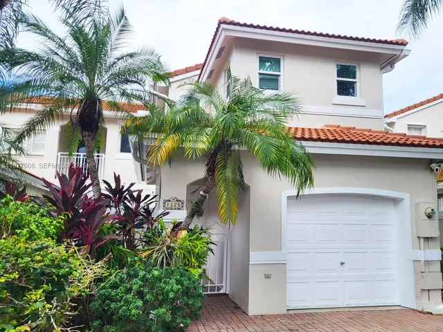 front view of a house with a potted plant