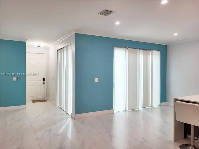 a view of entryway with wooden floor