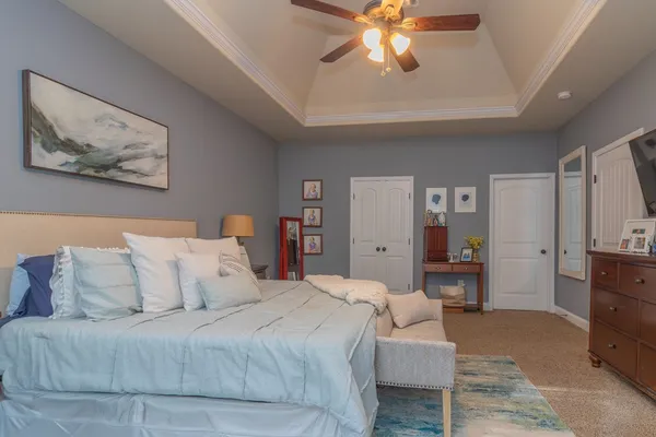 a kitchen with a refrigerator and cabinets
