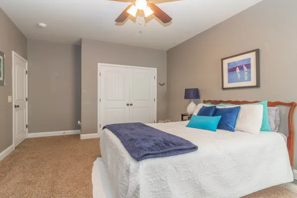 a bed room with a bed and a dresser