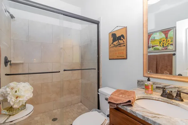 a view of a chairs and table in backyard