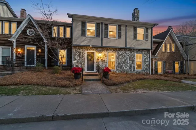 a view of a house with large windows