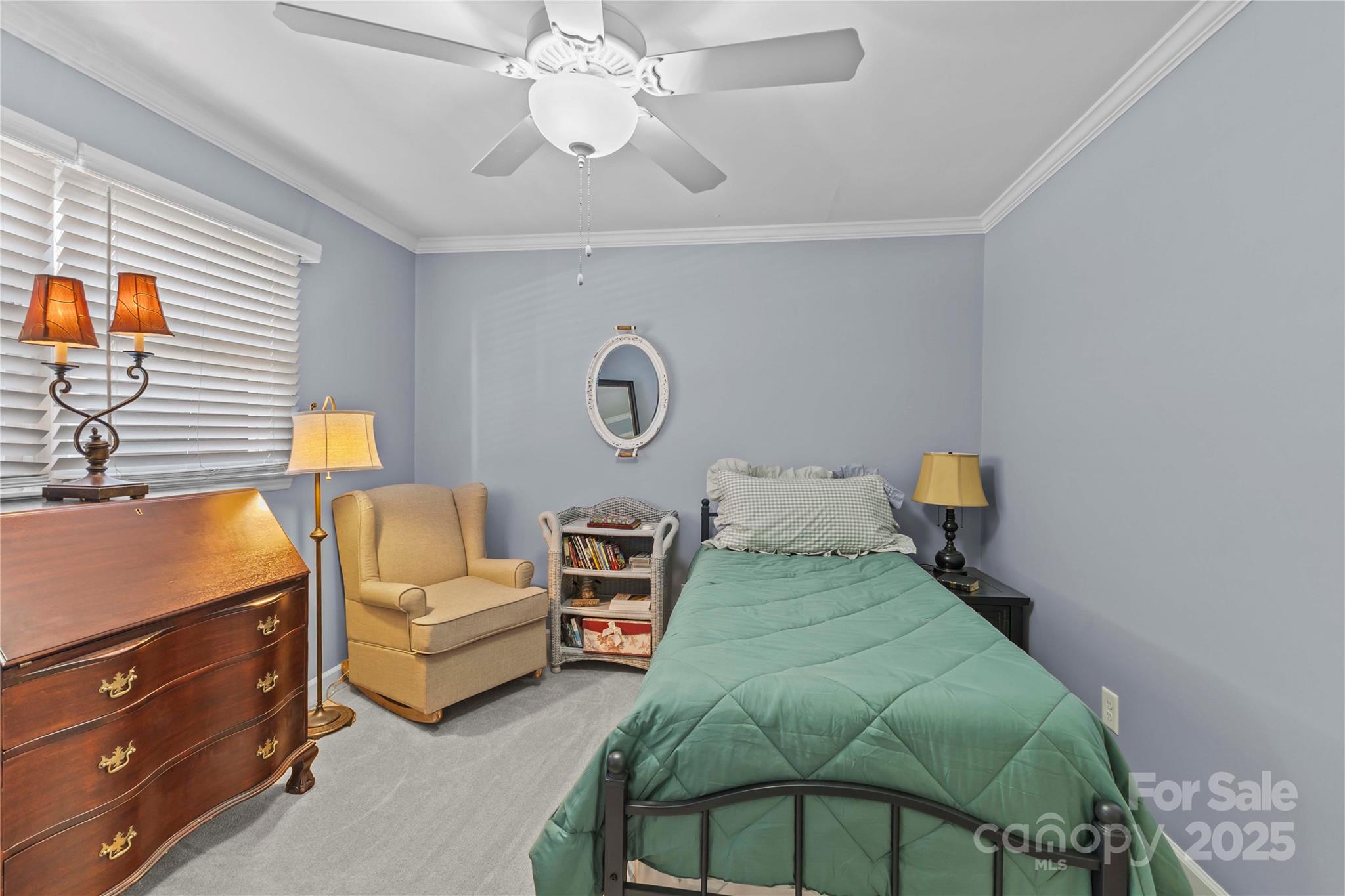 2502 Round Table Road, Unit D Monroe, NC 28110 - Photo 16 of 21 a bedroom with a bed couch and window