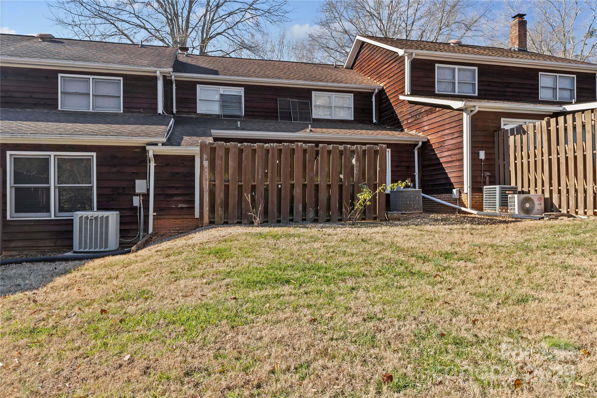 2502 Round Table Road, Unit D Monroe, NC 28110 - Photo 18 of 21 a view of a house with a yard