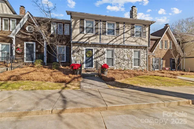 a view of a house with large windows