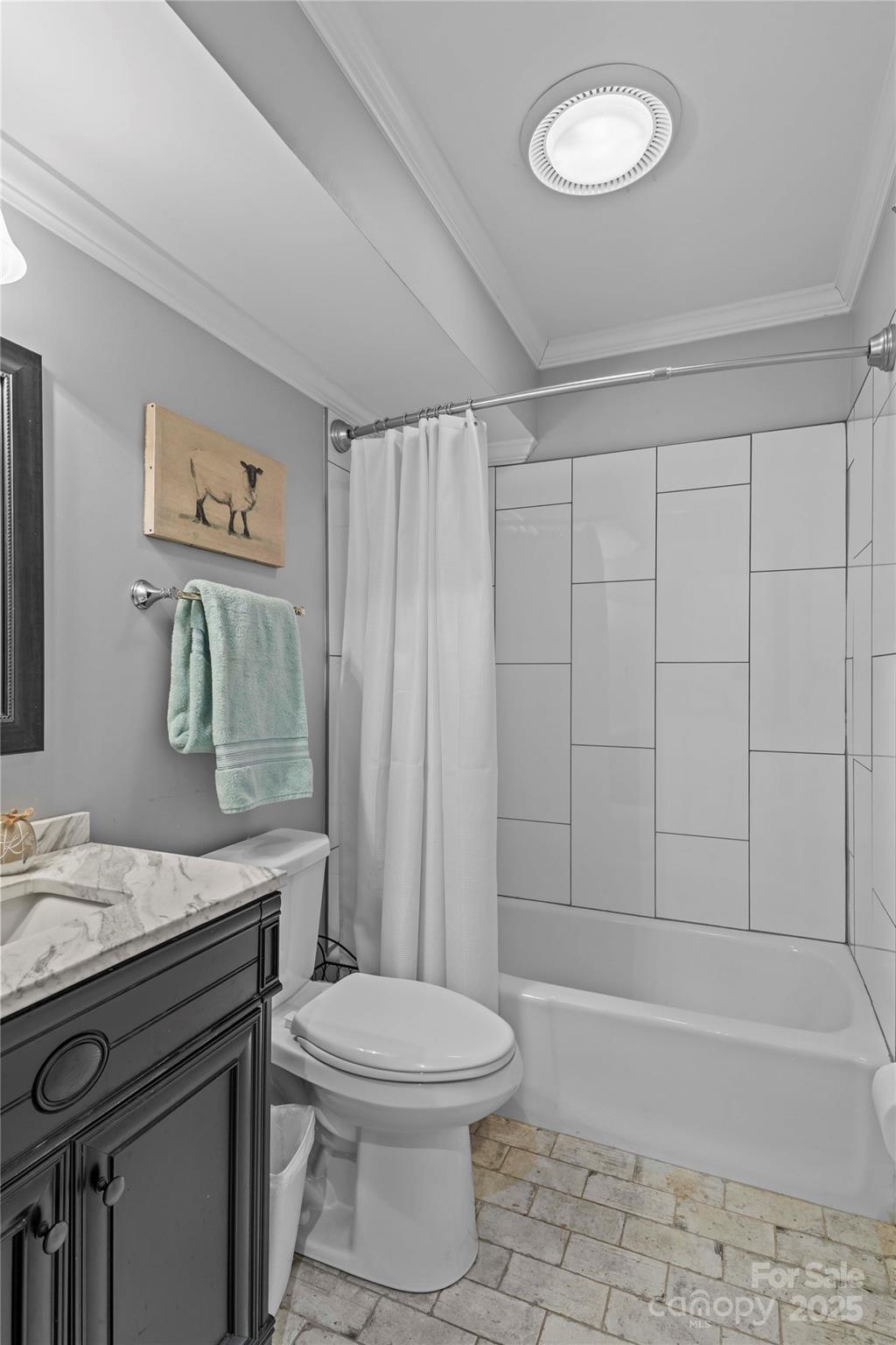 2502 Round Table Road, Unit D Monroe, NC 28110 - Photo 5 of 21 a bathroom with a sink a toilet and a bathtub
