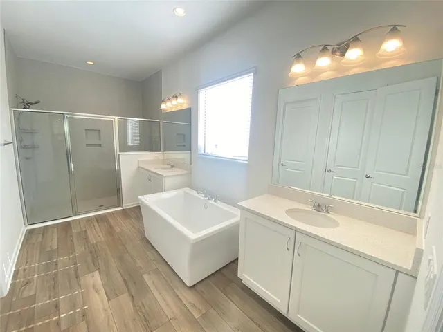 a bathroom with a sink and shower