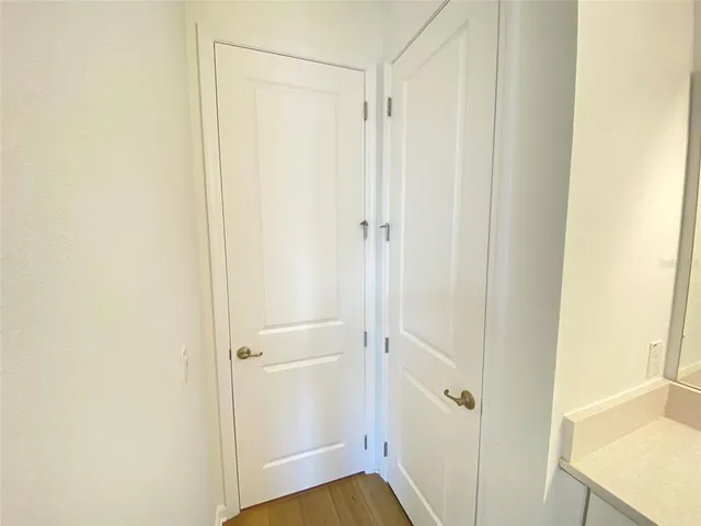 a view of a bathroom from a hallway