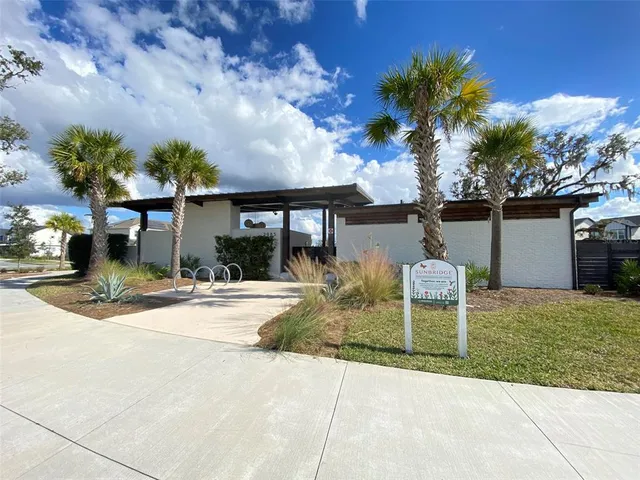 a view of a chairs and table in backyard