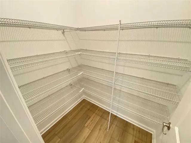 a view of a room with racks on the wall