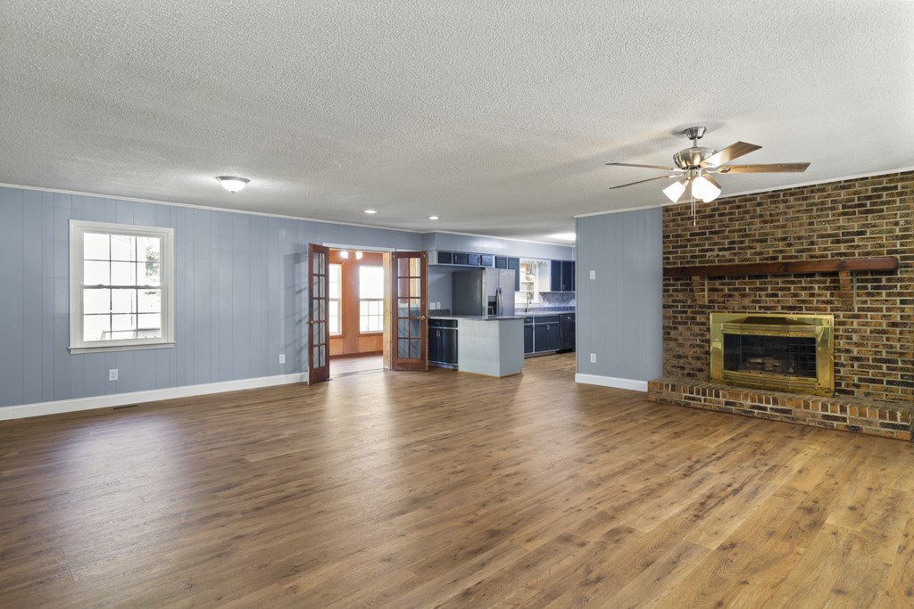 104 Doyle Drive Seneca, SC 29678 - Photo 5 of 19 This inviting space features an open layout with durable flooring and a cozy fireplace.