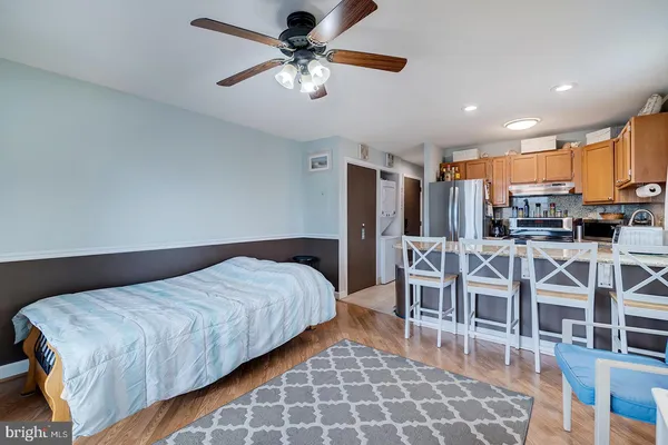 a bedroom with a bed a table and chairs