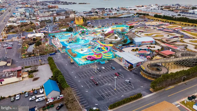 a view of house with ocean and boats in it