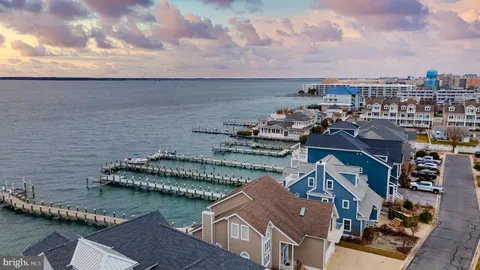 an aerial view of a house with a lake view