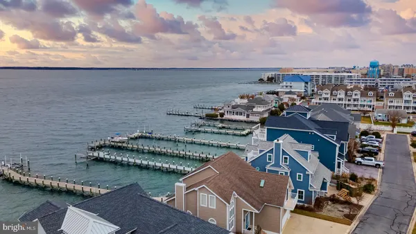 an aerial view of a house with a lake view