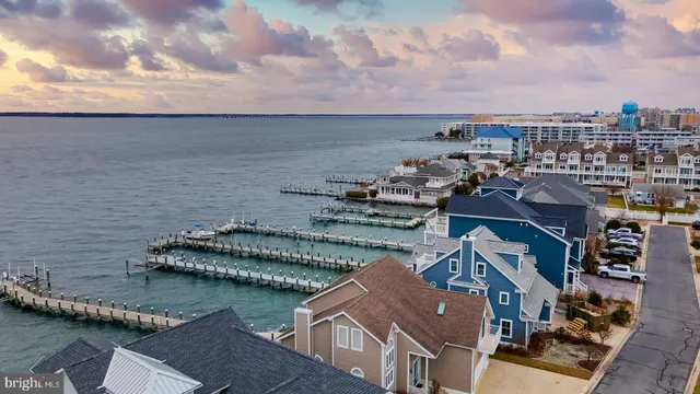 an aerial view of a house with a lake view