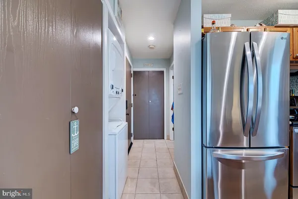 a view of closet with wooden floor