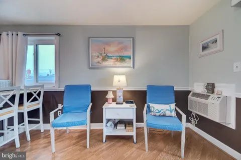 a workspace with furniture window and wooden floor