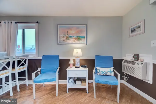 a workspace with furniture window and wooden floor