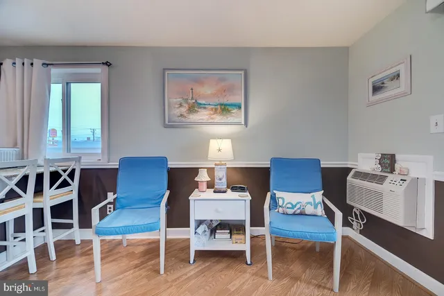 a workspace with furniture window and wooden floor