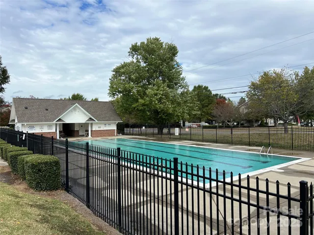 a view of a deck and yard with green space