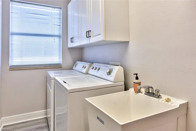 a utility room with dryer and washer
