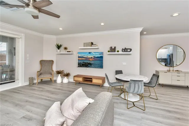 a bedroom with furniture and a wooden floor