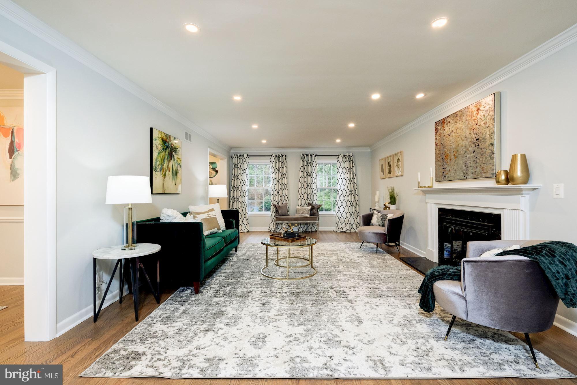 7440 Arrowood Road Bethesda, MD 20817 - Photo 15 of 79 a living room with furniture and a fireplace