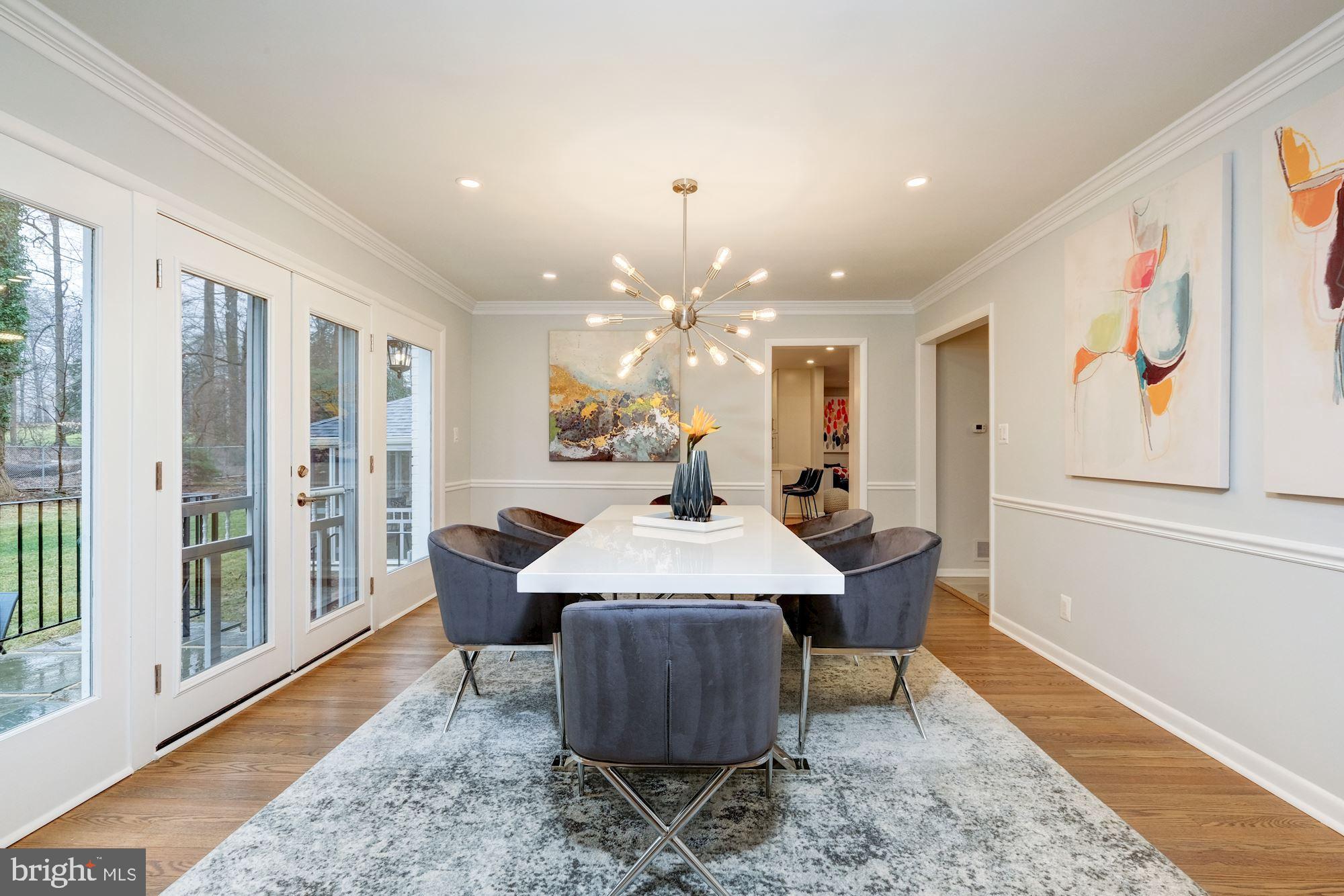 7440 Arrowood Road Bethesda, MD 20817 - Photo 17 of 79 a view of a dining room with furniture window and wooden floor