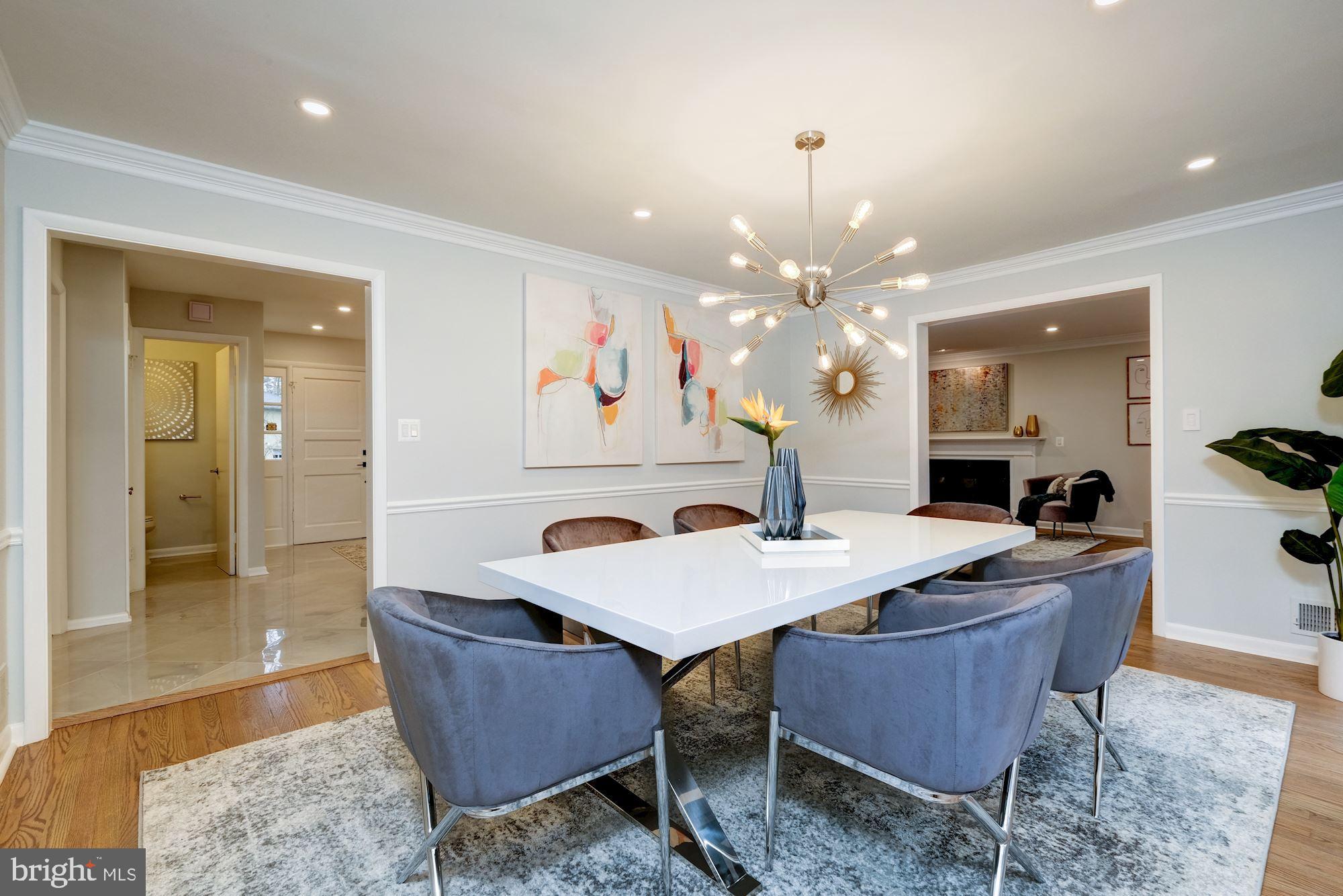 7440 Arrowood Road Bethesda, MD 20817 - Photo 20 of 79 a dining room with a wooden table and chairs