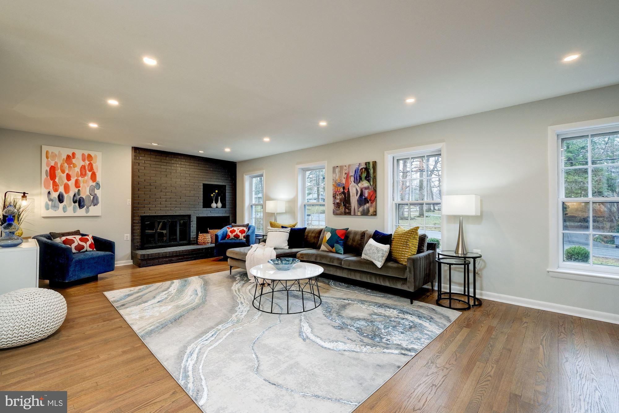 7440 Arrowood Road Bethesda, MD 20817 - Photo 28 of 79 a living room with furniture and a flat screen tv