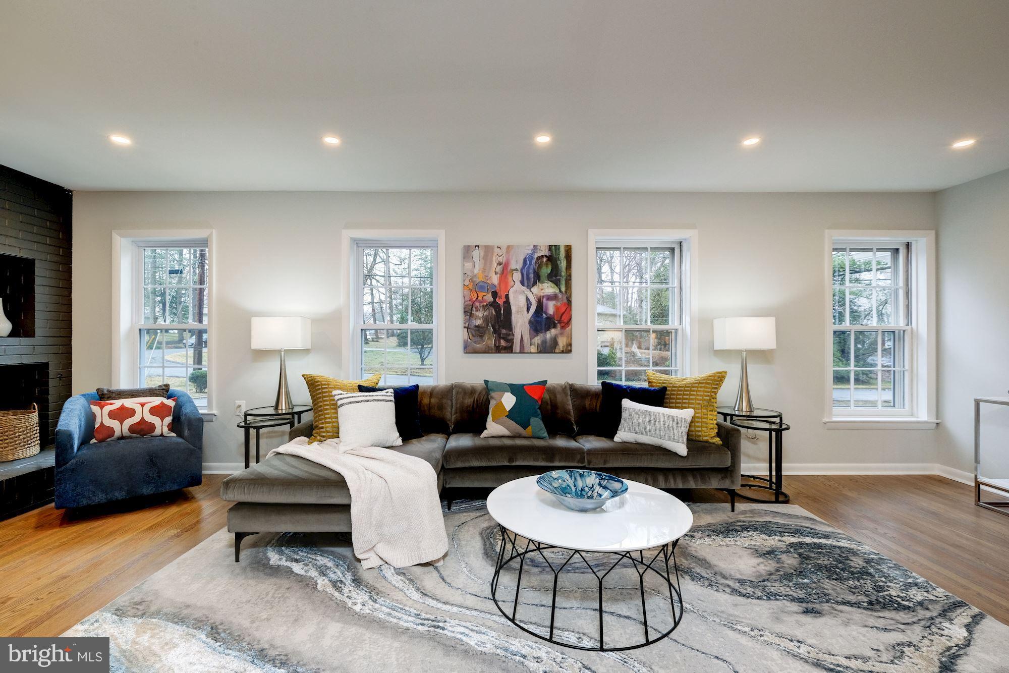 7440 Arrowood Road Bethesda, MD 20817 - Photo 29 of 79 a living room with furniture and a flat screen tv
