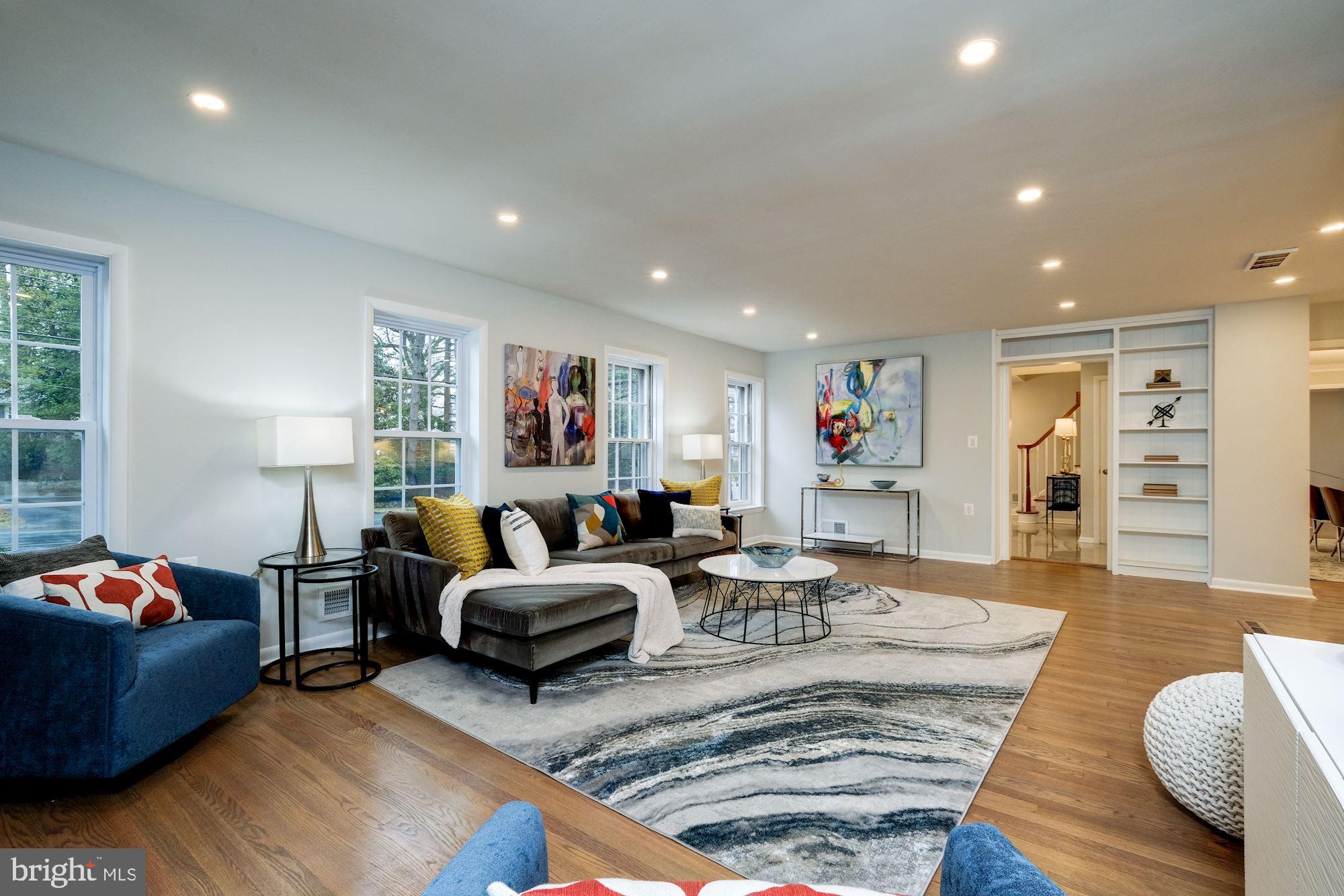 7440 Arrowood Road Bethesda, MD 20817 - Photo 30 of 79 a living room with furniture and a wooden floor
