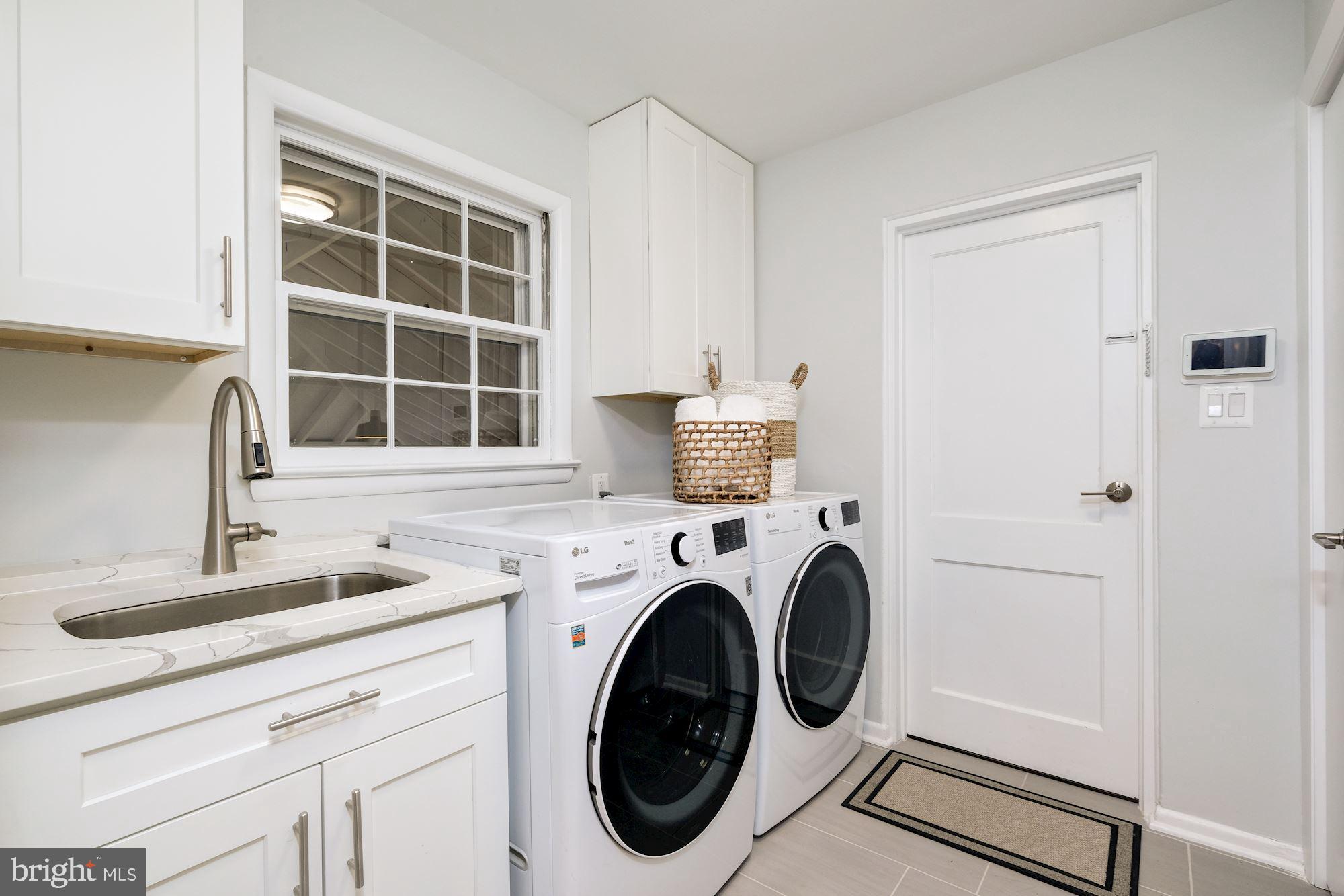 7440 Arrowood Road Bethesda, MD 20817 - Photo 34 of 79 a utility room with dryer and washer