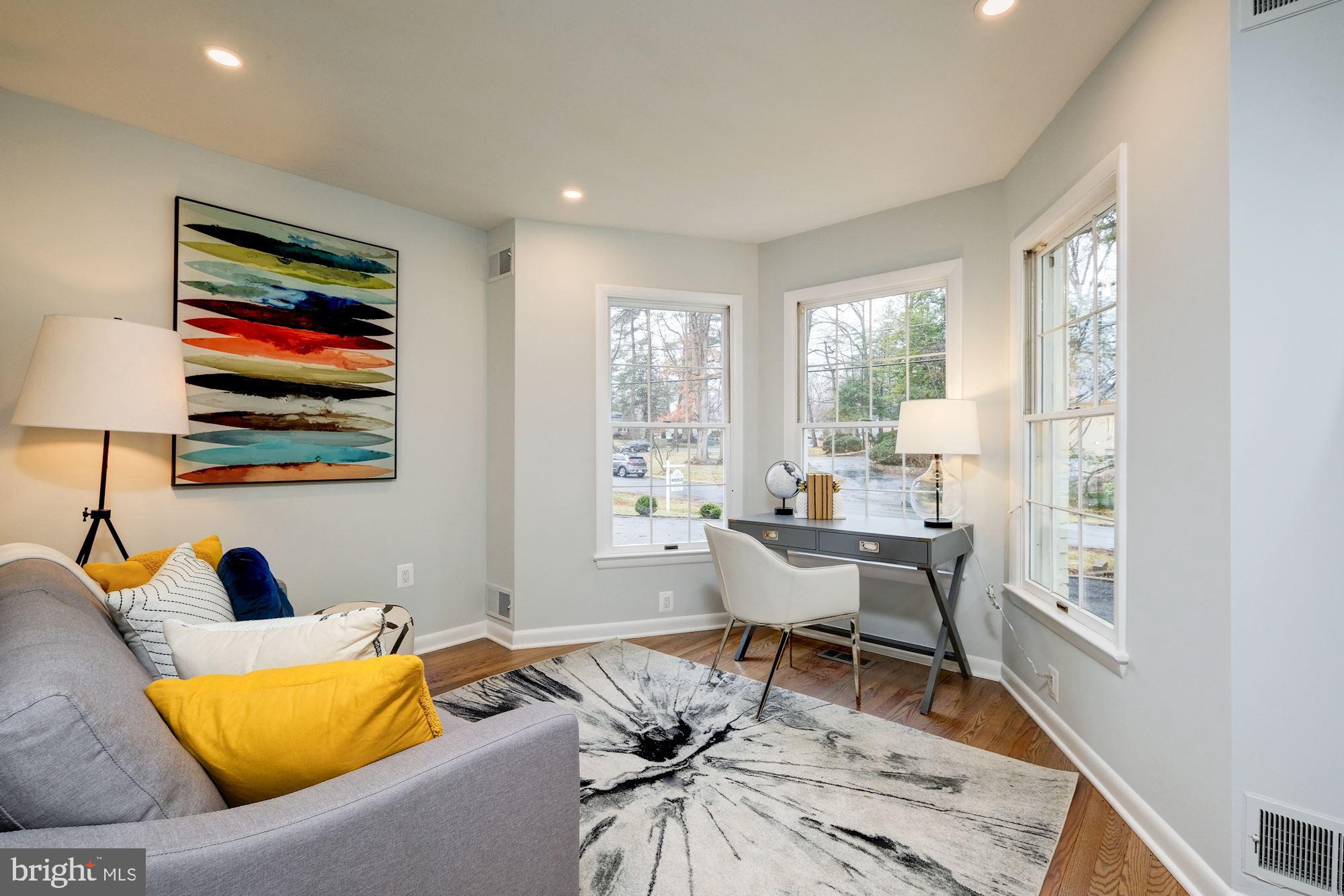 7440 Arrowood Road Bethesda, MD 20817 - Photo 38 of 79 a living room with furniture and a large window