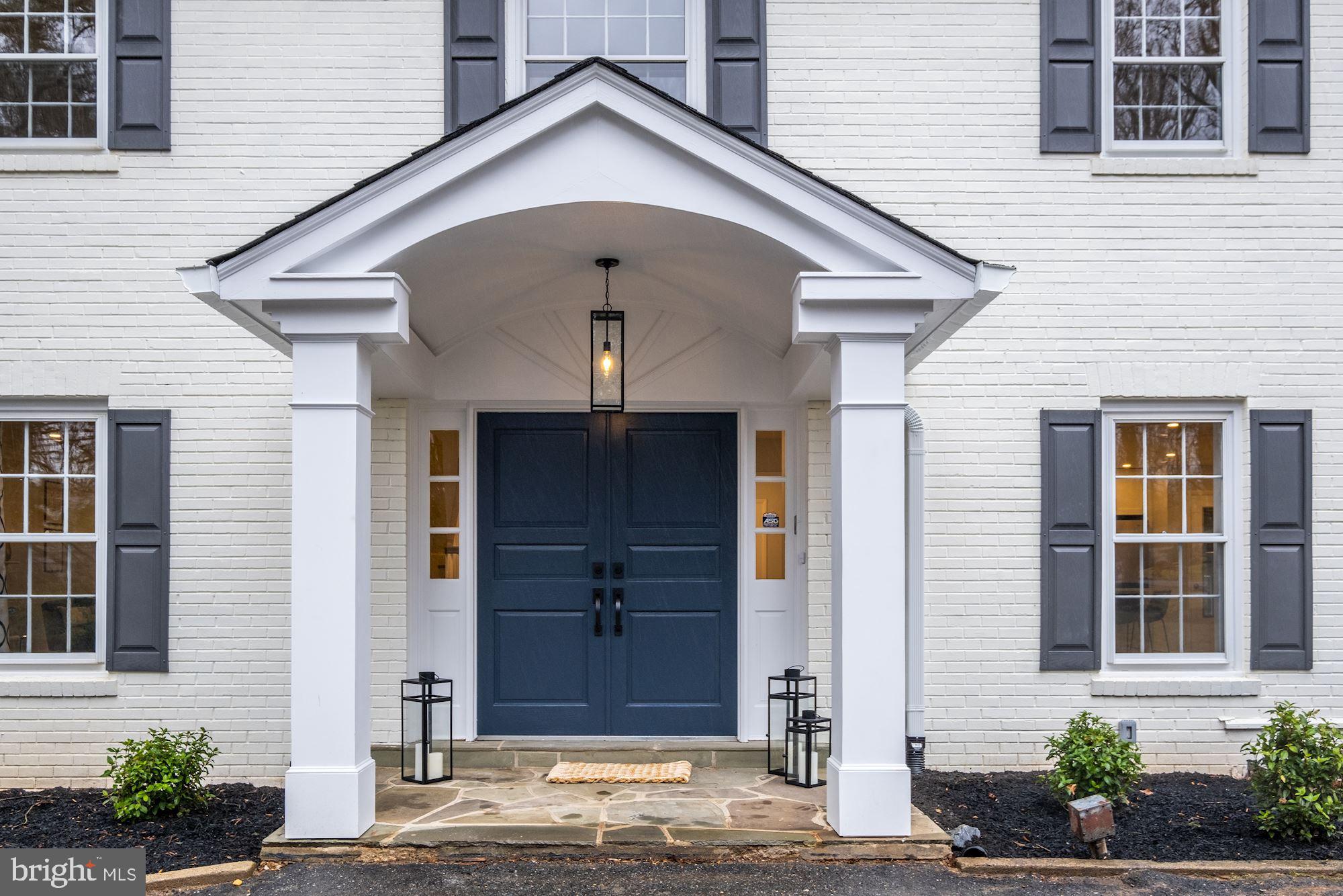 7440 Arrowood Road Bethesda, MD 20817 - Photo 4 of 79 a front view of a house with a yard