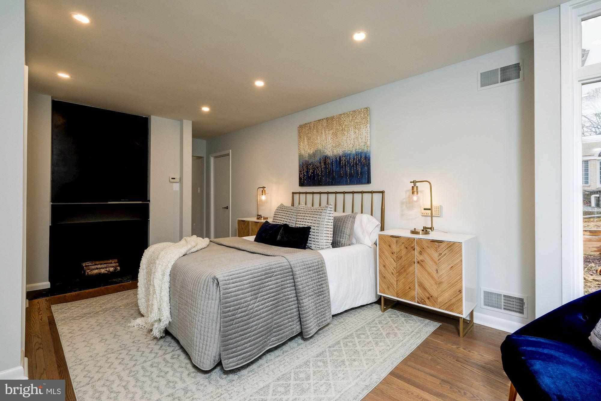 7440 Arrowood Road Bethesda, MD 20817 - Photo 41 of 79 a bedroom with a bed and a mirror